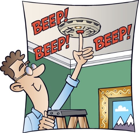man testing smoke alarm